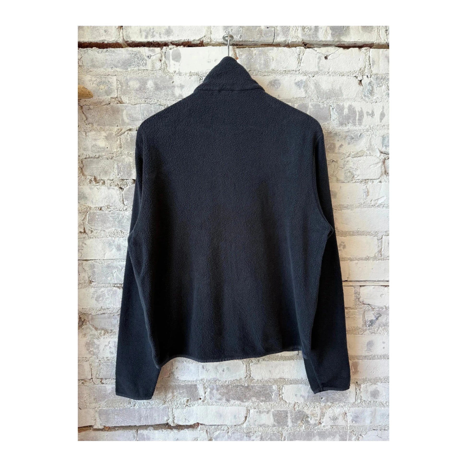 Men's navy PF jacket by 04651 with front zipper and collar, shown on a hanger against a plain background.