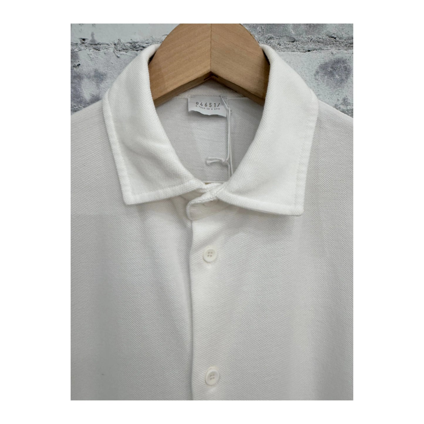 Men's white Piqué slim collar shirt by 04651, featuring a classic fit and textured fabric, shown in a close-up front view.