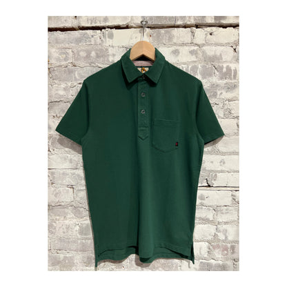 Men's Forest Green Pique Slot Polo shirt by Relwen, showing a close-up of the textured fabric and collar details.