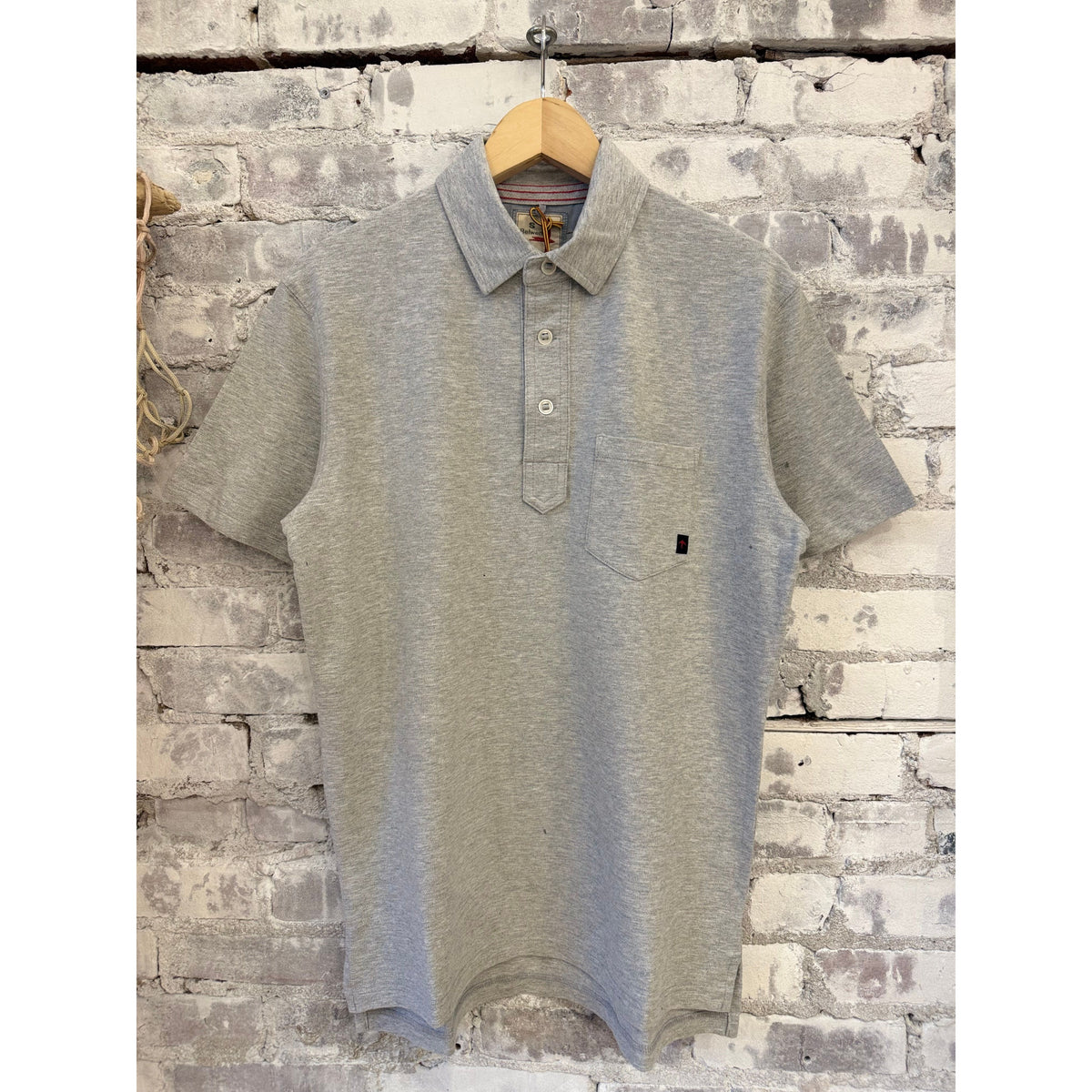 Men's grey heather Pique Slot Polo shirt by Relwen, featuring classic collar and textured pique fabric.