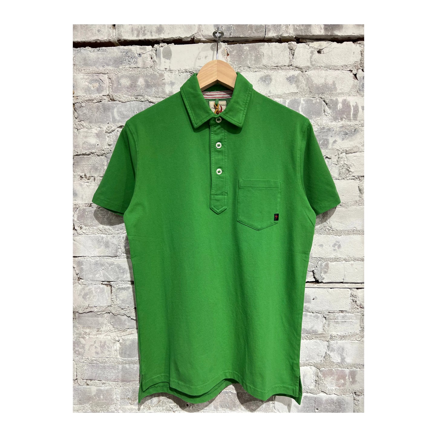Men's Relwen Pique Slot Polo in lawn green, featuring a classic collared design and textured pique fabric.