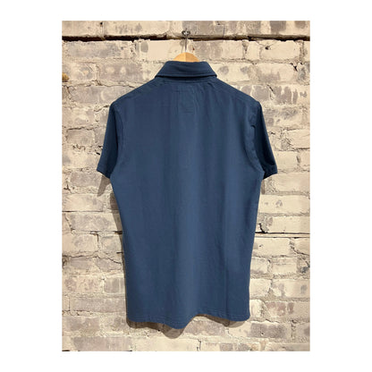 Men's Marine Blue Pique Slot Polo shirt by Relwen, featuring a classic collar and short sleeves, displayed on a hanger.