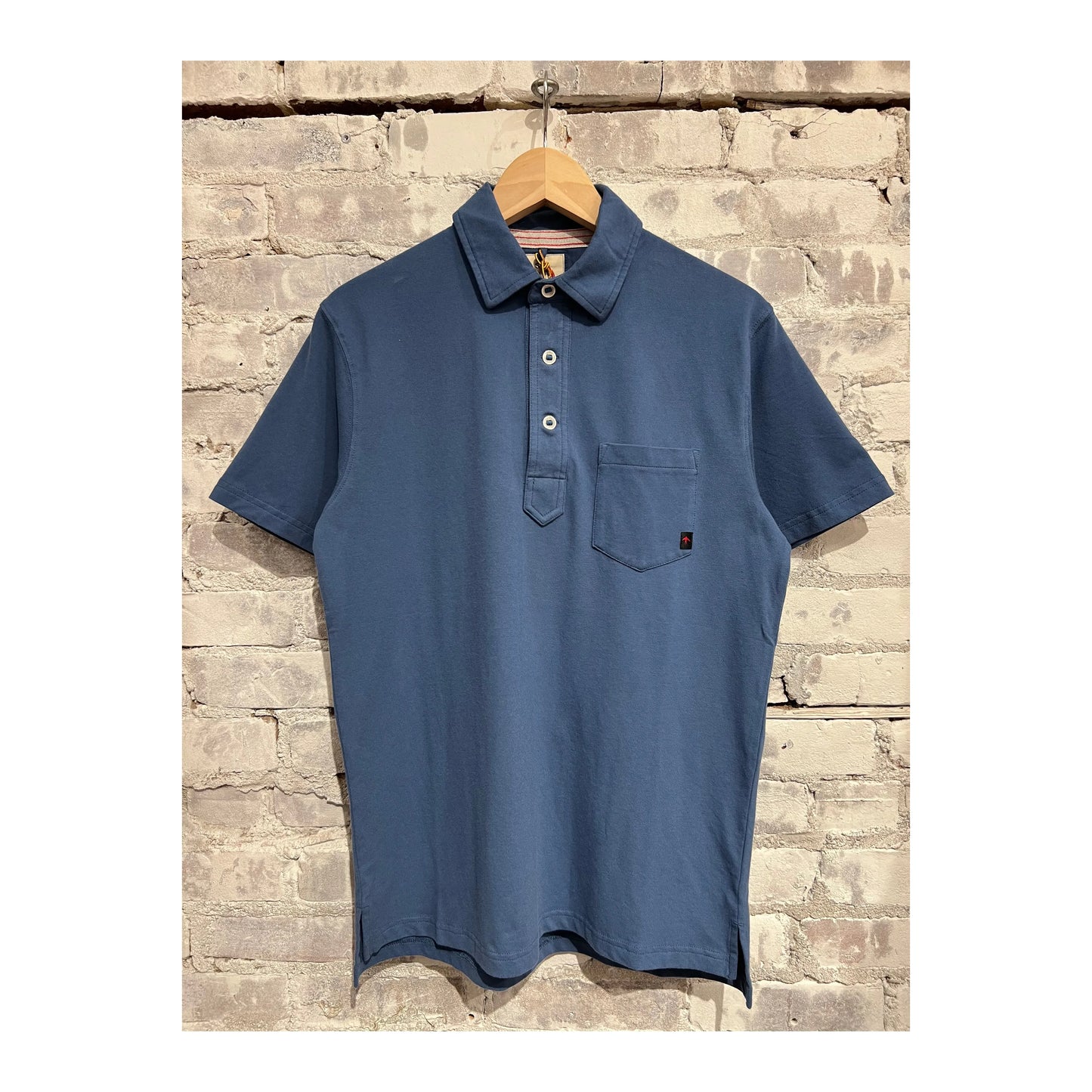 Men's Marine Blue Pique Slot Polo shirt by Relwen, featuring a classic collar and textured pique fabric.