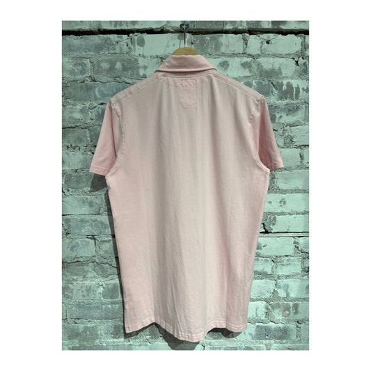 Men's pale pink Pique Slot Polo by Relwen, showing the textured fabric and classic collar style on a flat lay.