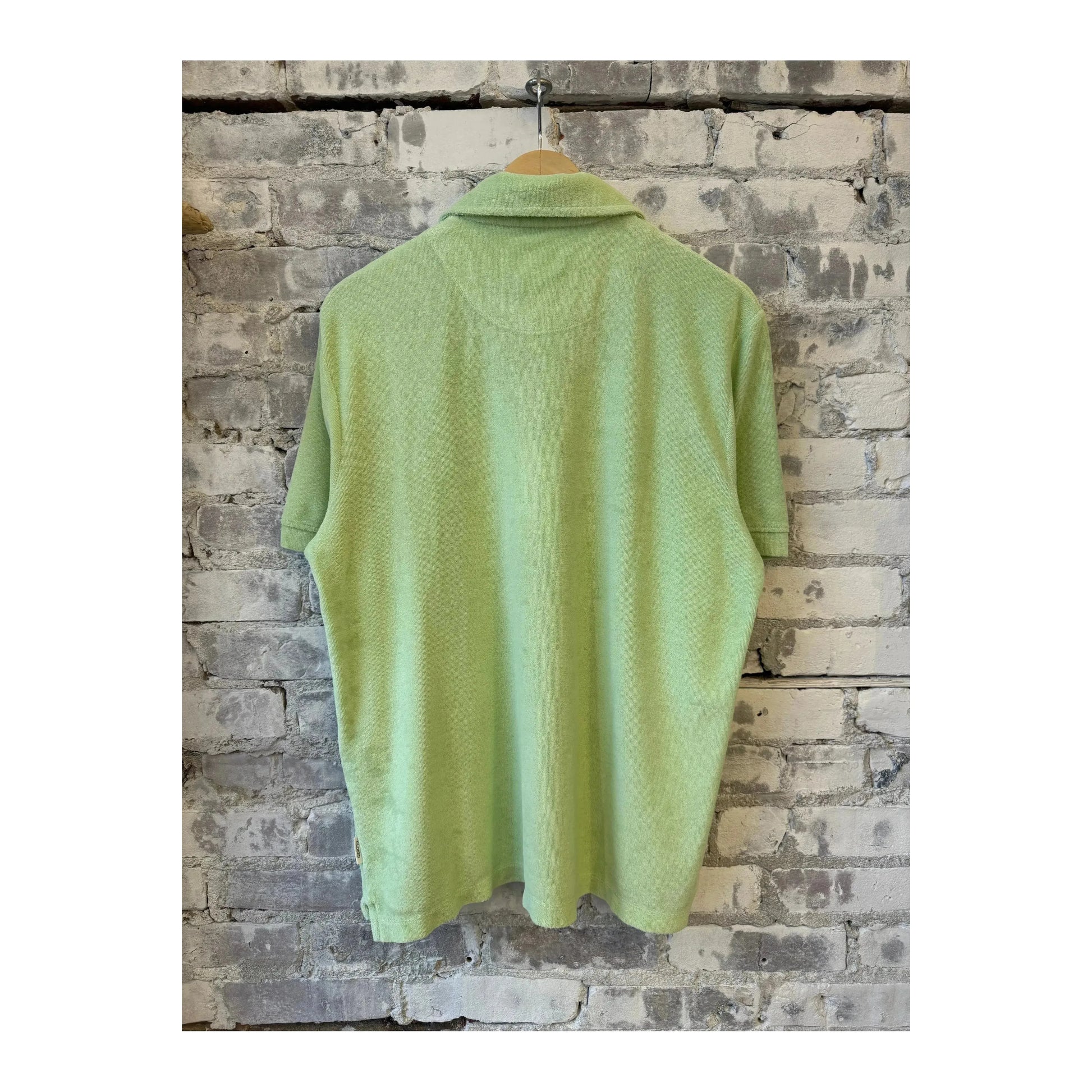 Men's polo collar shirt in bud green by Closed Men's, featuring a classic fit with short sleeves and a button-up front.