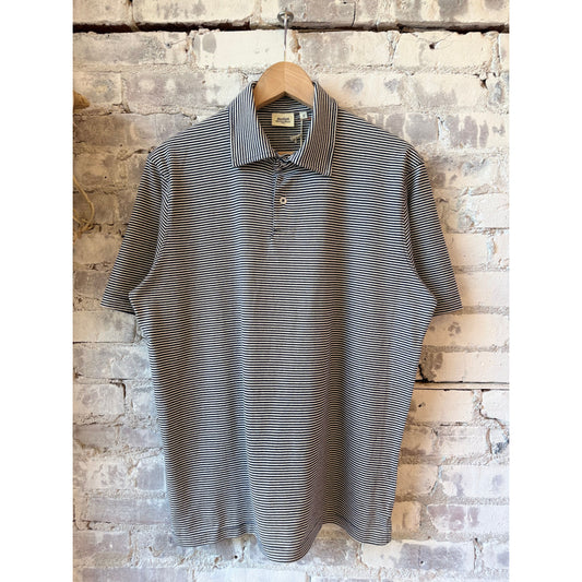 Men's navy and white striped knitted polo shirt by Hartford Men's, featuring a classic collared design and short sleeves.