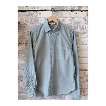Men's Surf Poplin Standard Shirt by Save Khaki United, light blue with a classic collar and button-down front.