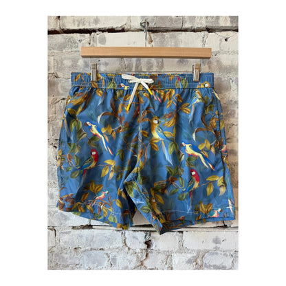 Men's printed swim trunks featuring a blue parrot design by Hartford Men's, displayed on a clean background.
