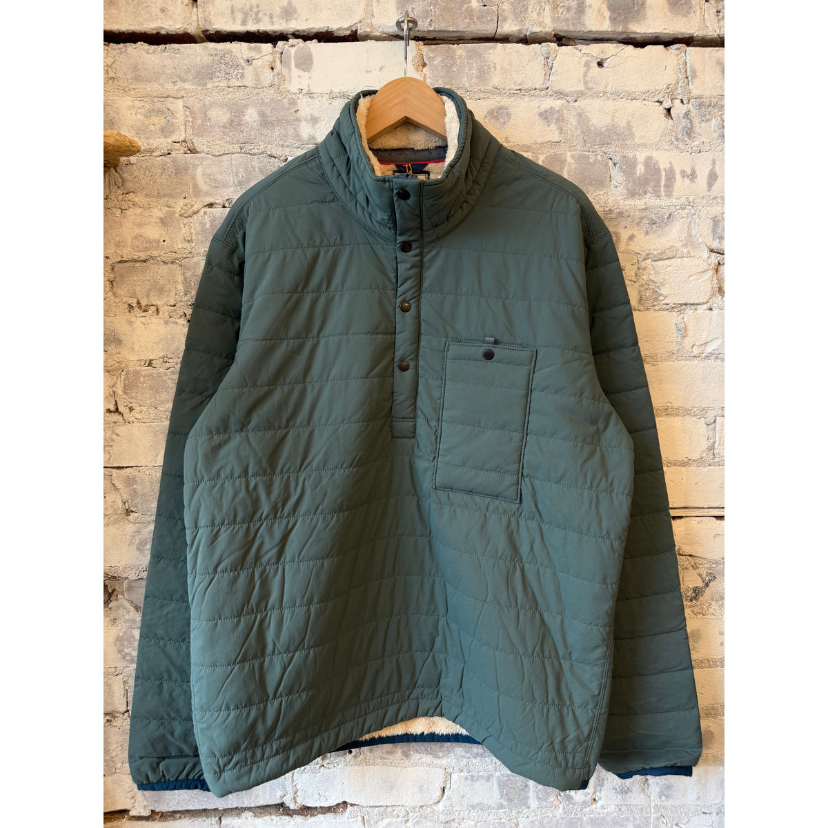 Relwen men's Superfleece Popover in spruce color, cozy fleece fabric, with a front pocket and button collar detail.