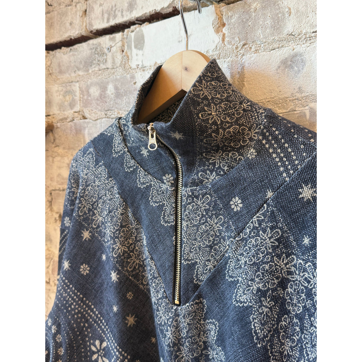 Women's Hope For Flowers indigo bandana quarter zip pullover displayed on a model, showcasing the stylish casual top.