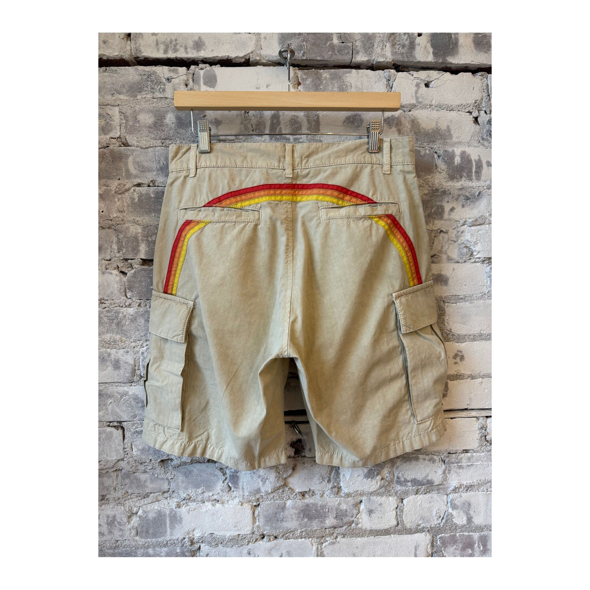 Men's rainbow garment-dyed cargo shorts by Sundek in sand color, featuring multiple pockets and relaxed fit.