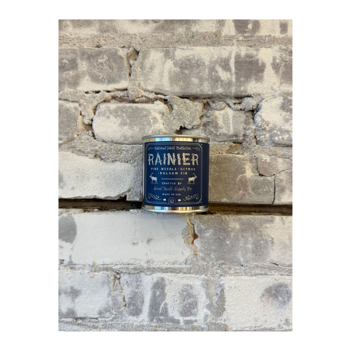 Rainier National Park scented candle by Good & Well Supply Co. featuring a scenic mountain design on the candle jar.
