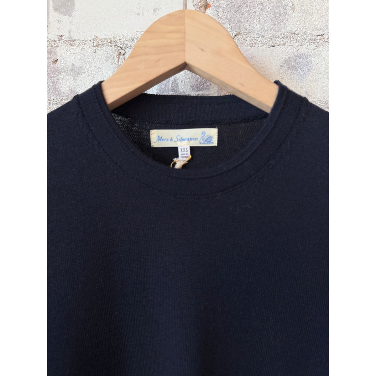 Dark navy women's Merz B. Schwanen merino wool short sleeve T-shirt, close-up view showing soft fabric and fit.