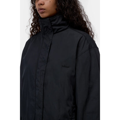 Women's black Relaxed Parka by Closed, showcasing a casual fit with a hood and front pockets, ideal for everyday wear