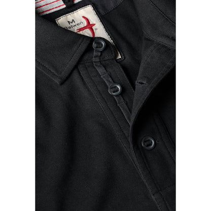 Men's black pique slot polo shirt by Relwen, featuring a classic collar and short sleeves, displayed on a plain background.