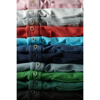 Men's pale pink Pique Slot Polo by Relwen, displaying a classic collared polo shirt with a textured pique fabric.