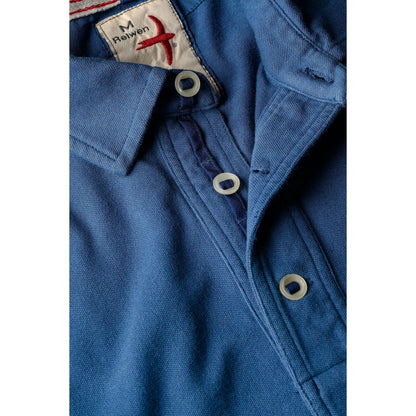 Men's marine blue pique slot polo shirt by Relwen, featuring a classic fit and textured fabric, shown on a model.