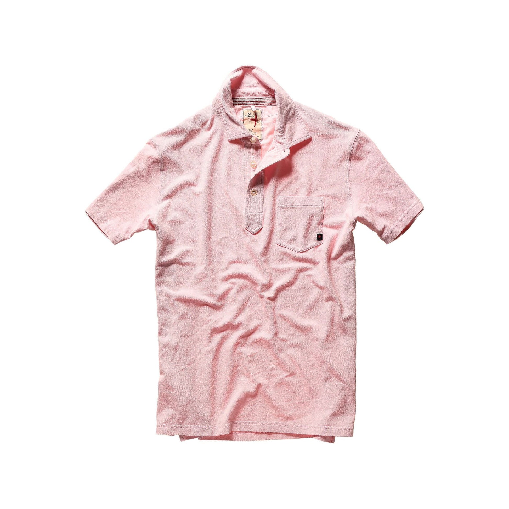 Men's pale pink pique slot polo shirt by Relwen, showing the textured fabric and classic collar style.