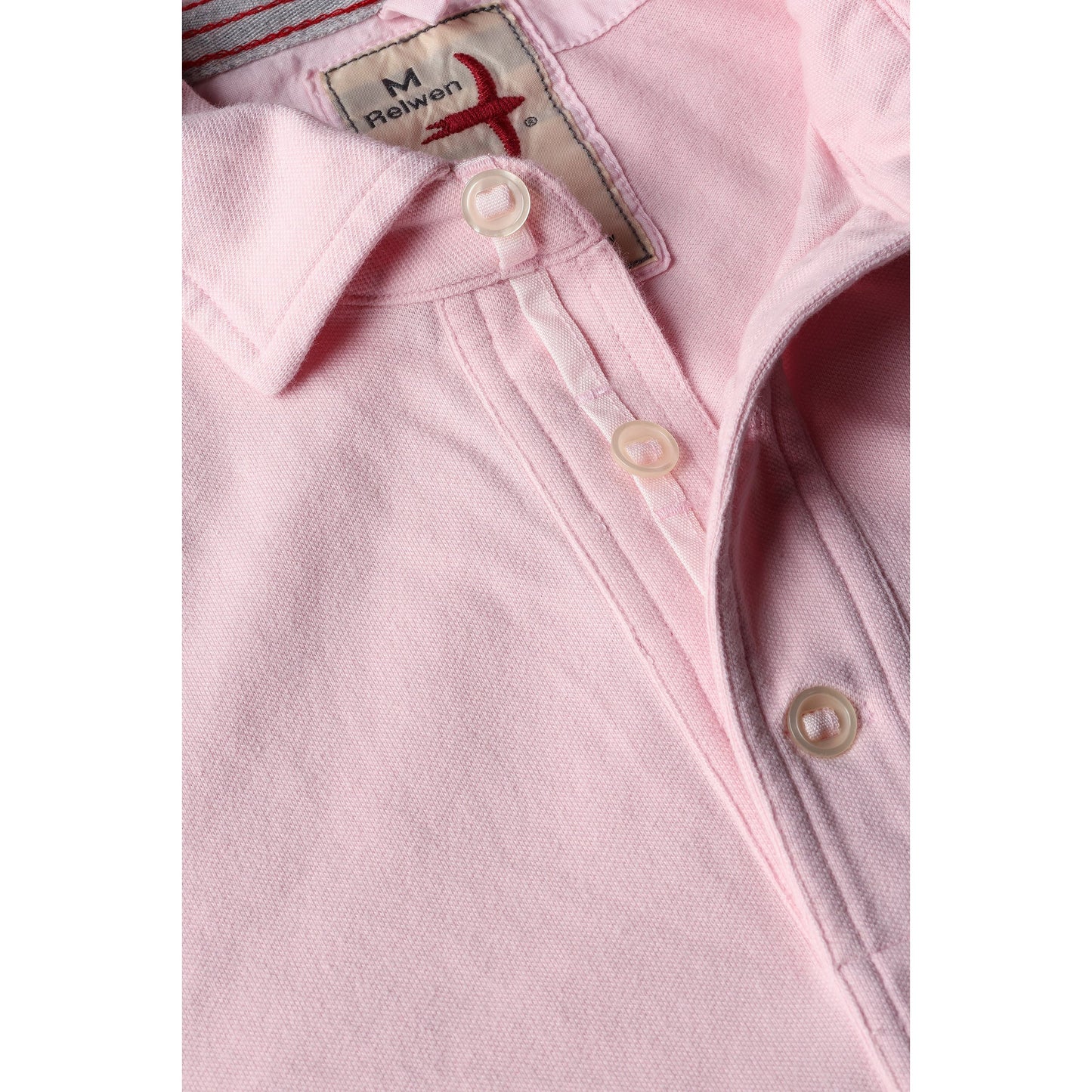 Men's pale pink Pique Slot Polo shirt by Relwen, featuring classic collar and textured pique fabric.