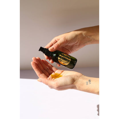 Clary Collection Renew + Repair Oil 2oz bottle, close-up of the natural skincare accessory with dropper cap.