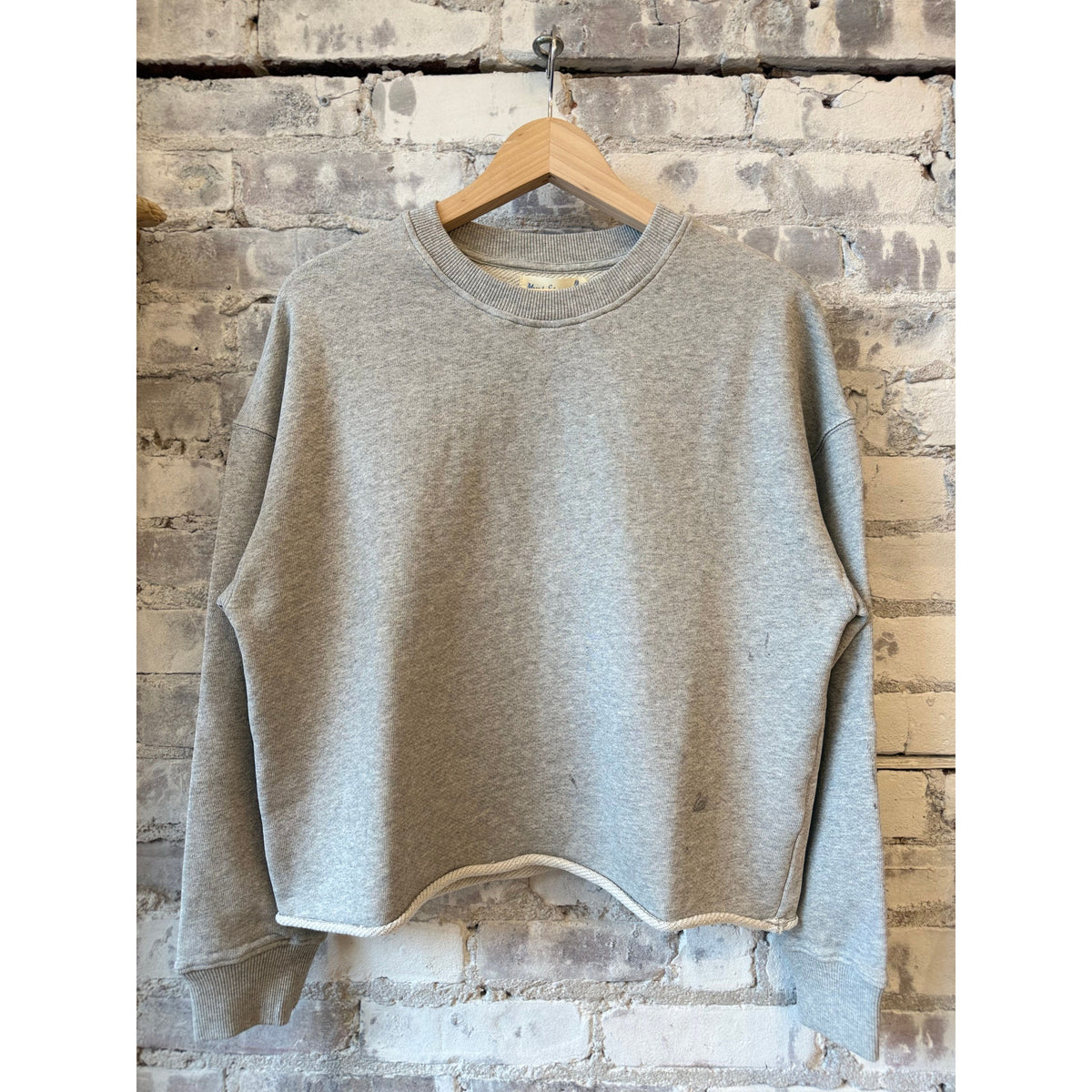 Women's grey melange retro fleece sweatshirt with open edge hem by Merz b. Schwanen, showing relaxed fit and cozy fabric.