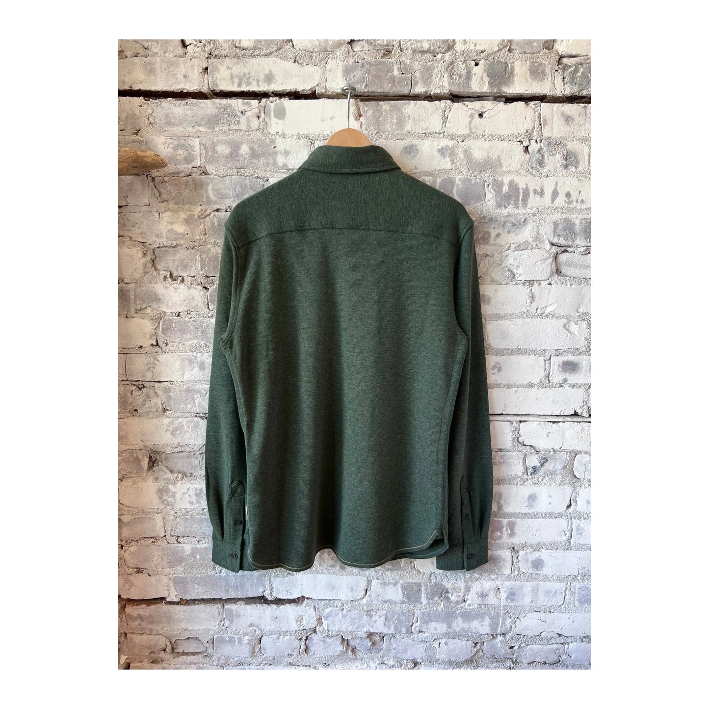 Men's Rex Soft Knit Shirt in Green Heather by Surfside Supply, shown laid flat with long sleeves and a classic knit texture.