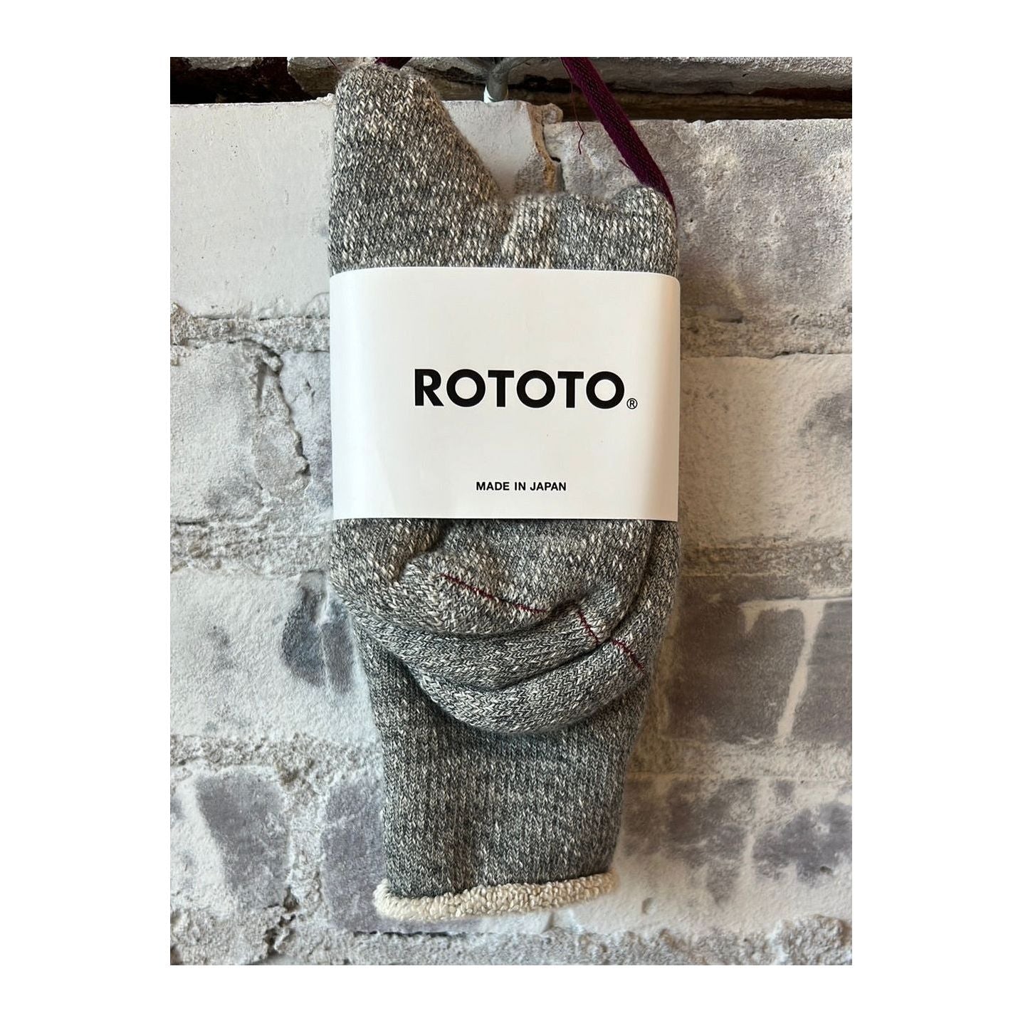 Men's double-face crew socks by Rototo in medium gray, showing the soft, dual-sided knit fabric and comfortable crew length.