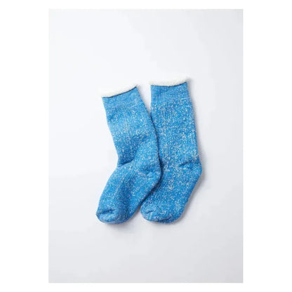 Men's double-face crew socks by Rototo in blue, featuring a cozy, reversible design with contrasting patterns and soft fabric.