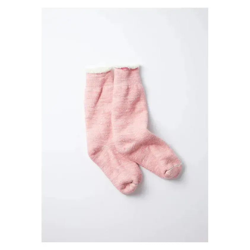 Men's double-face crew socks by Rototo in light pink, showing the soft, knit fabric and stylish two-tone design.