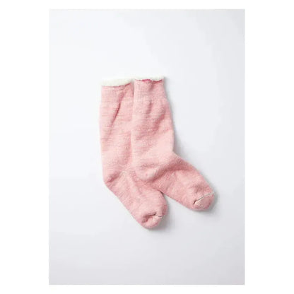 Men's double-face crew socks by Rototo in light pink, showing the soft, knit fabric and stylish two-tone design.