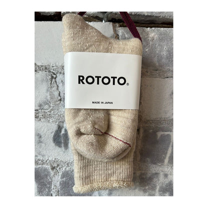 Men's double-face crew socks by Rototo in oatmeal color, showcasing a cozy, dual-texture design with ribbed cuffs.