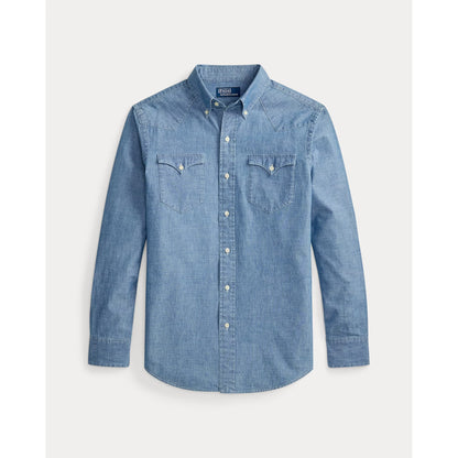 Men's Polo RL chambray classic western sport shirt in medium indigo, shown in a casual lifestyle setting.