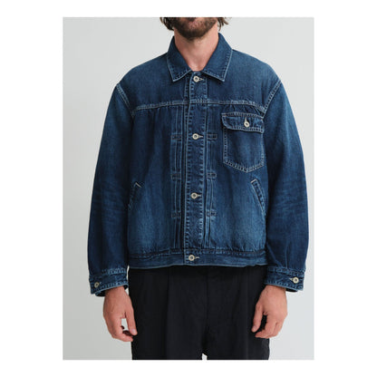 Men's indigo blue denim short jacket by Sage De Cret, featuring classic design and casual fit.
