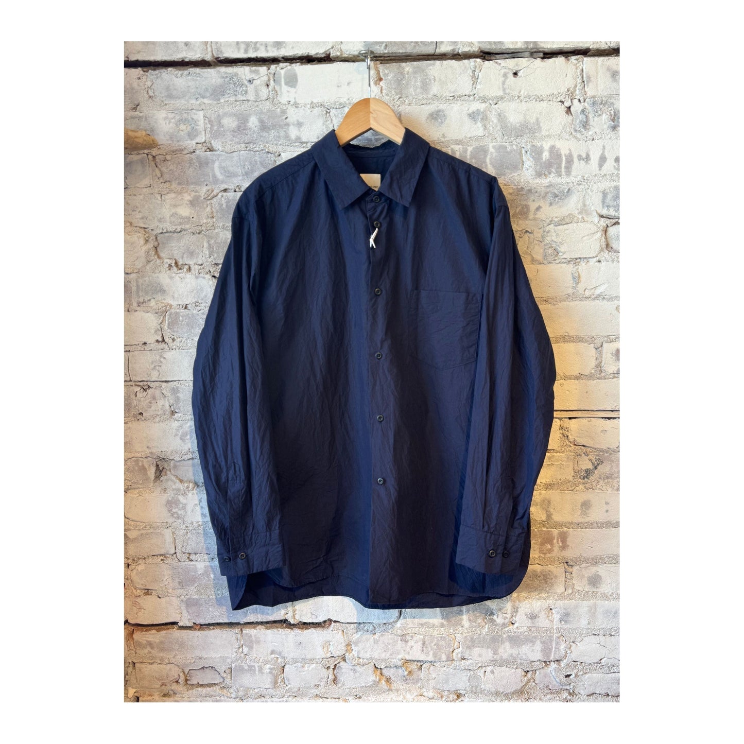 Men's navy crinkle typewriter collar shirt by Sage De Cret, featuring a regular collar and textured fabric.