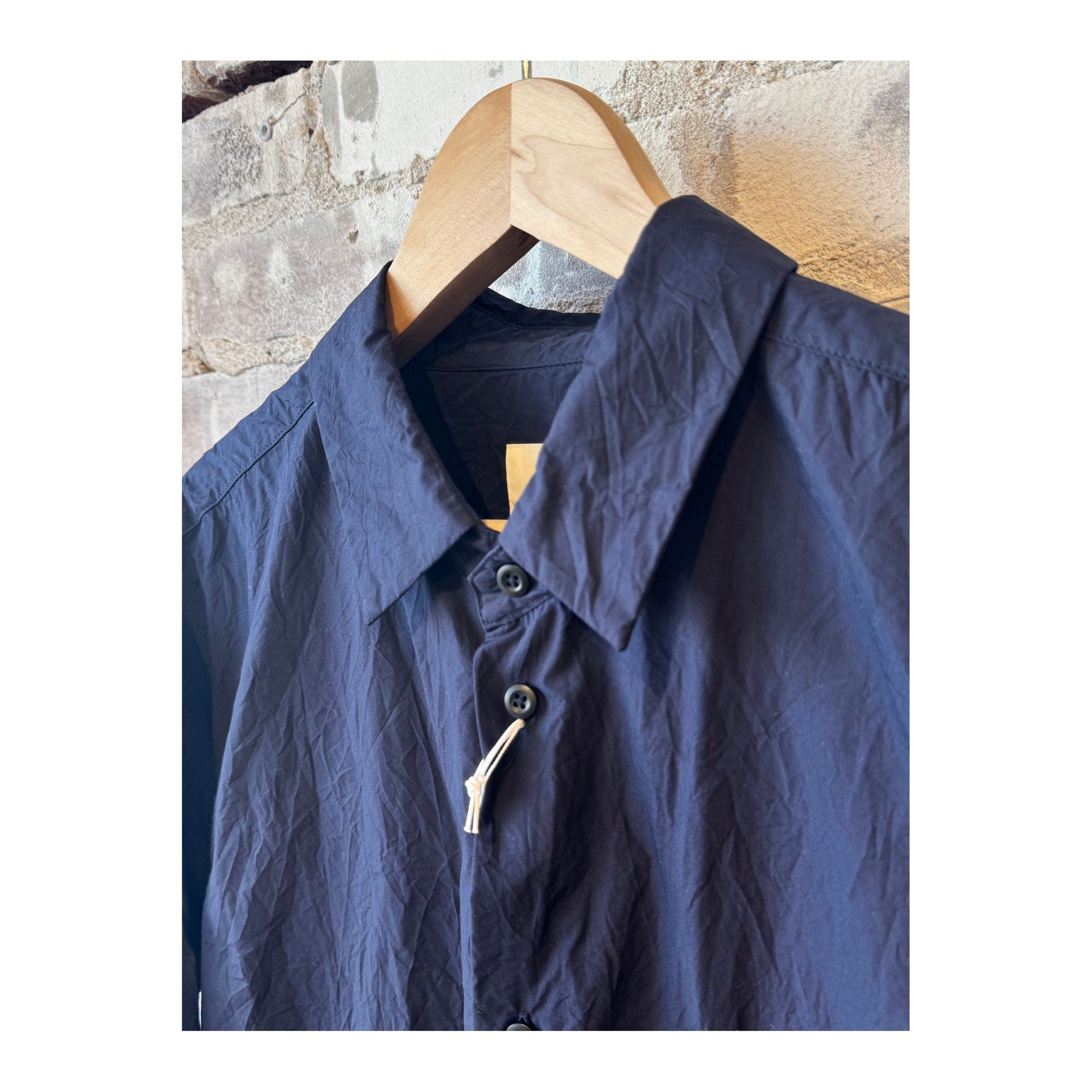 Men's navy crinkle typewriter collar shirt by Sage De Cret, featuring a regular collar and textured fabric.
