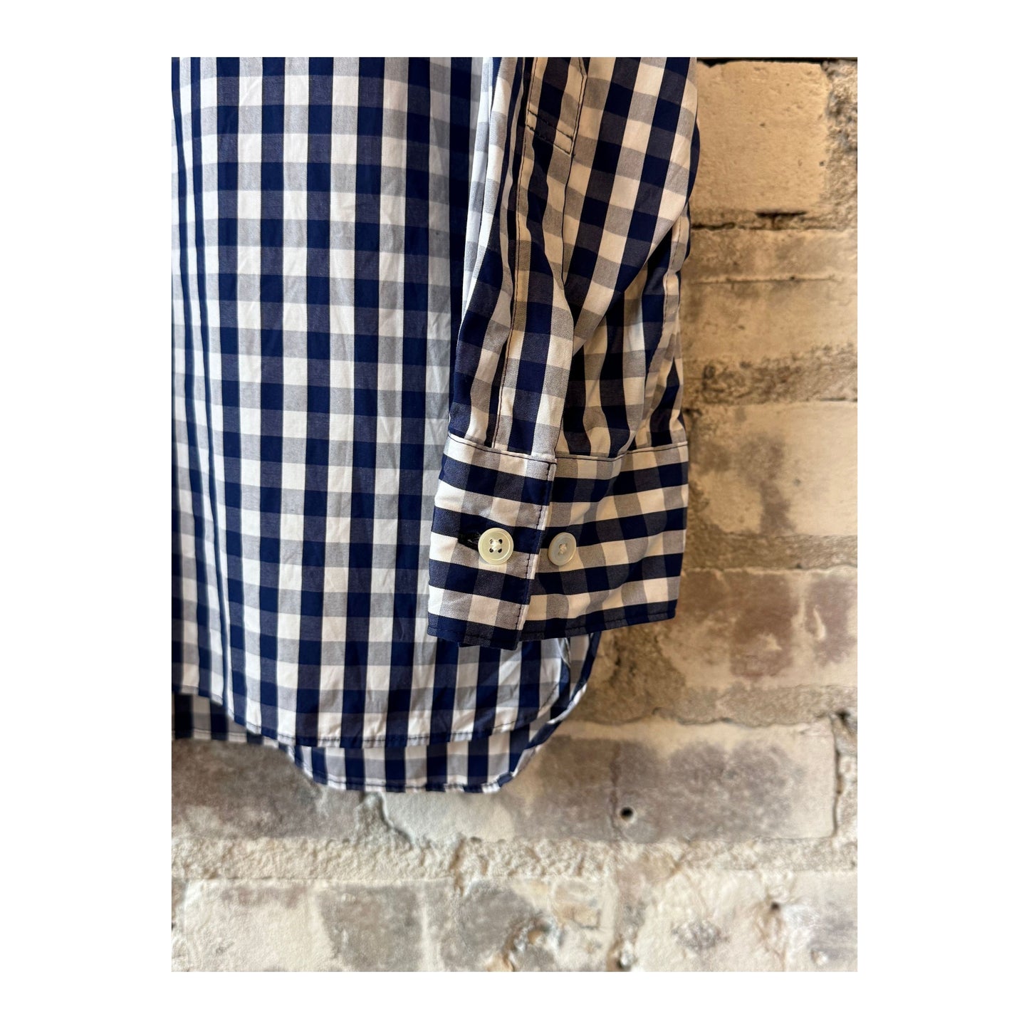 Men's navy gingham check regular collar shirt by Sage De Cret, showing close-up of the classic pattern and collar details.