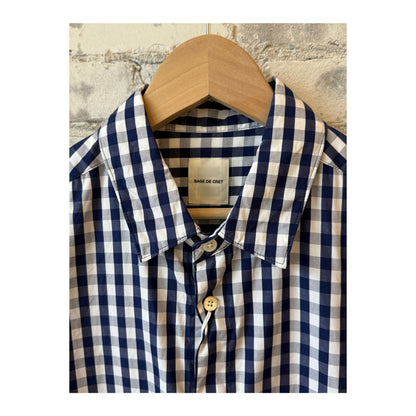 Men's navy gingham check shirt with regular collar by Sage De Cret, showing the classic pattern and tailored fit.