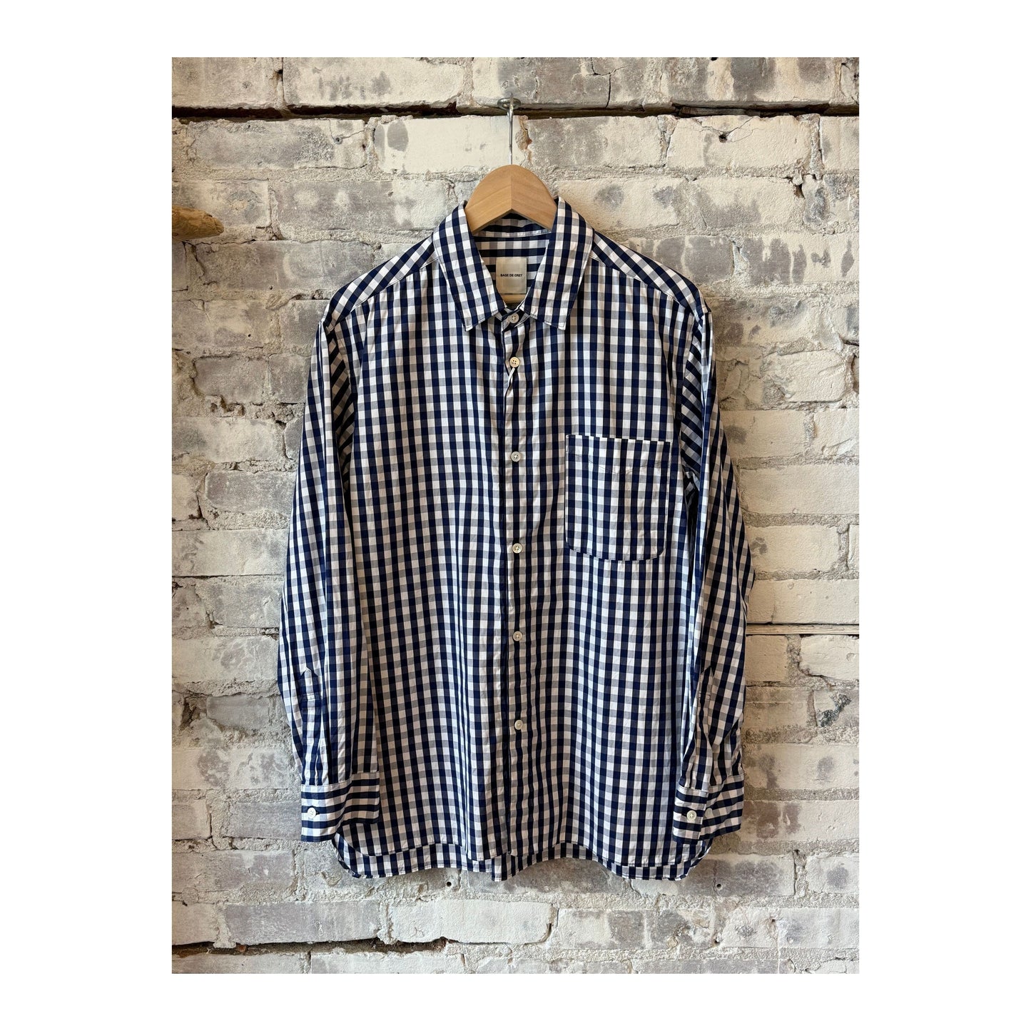 Men's navy gingham check shirt with a regular collar by Sage De Cret, showcasing the classic pattern and tailored fit.