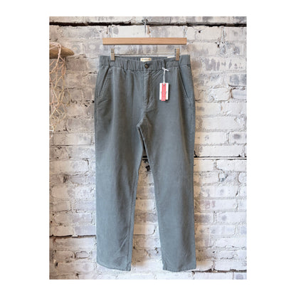 Men's Marine Layer Saturday Slim-Straight Moleskin Chino in Balsam Green, showing the fit and fabric texture of the men's chino pants.