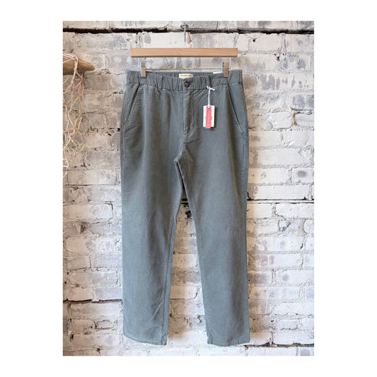 Men's Marine Layer Saturday Slim-Straight Moleskin Chino in Balsam Green, showing the fit and fabric texture of the men's chino pants.