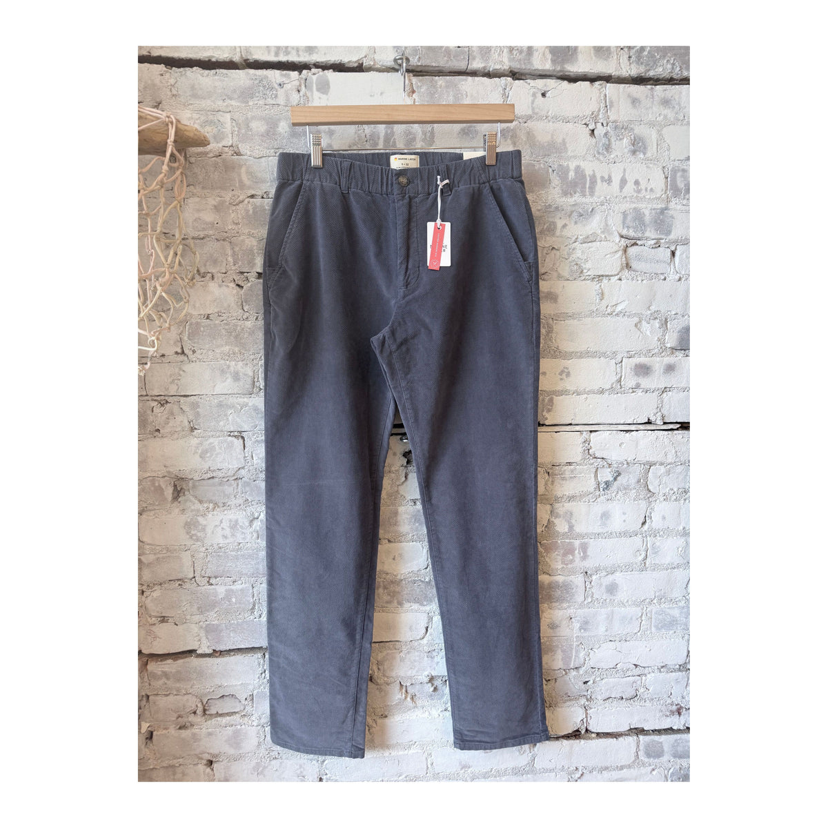 Men's Marine Layer Saturday Slim-Straight Moleskin Chino in Mood Indigo, showing the fitted style and rich fabric texture.