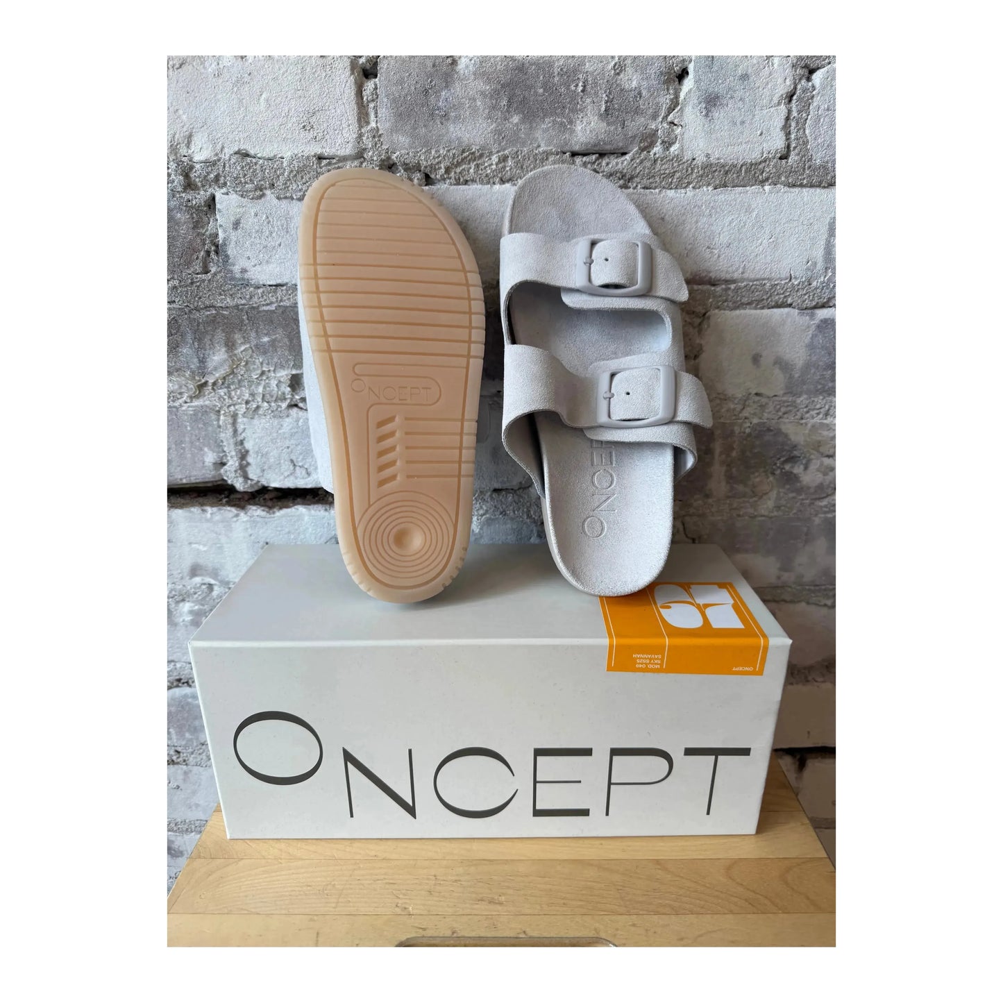 Women's Savannah Hydro-Suede Slide sandal by Oncept in ice color, featuring a sleek design and comfortable slip-on style.