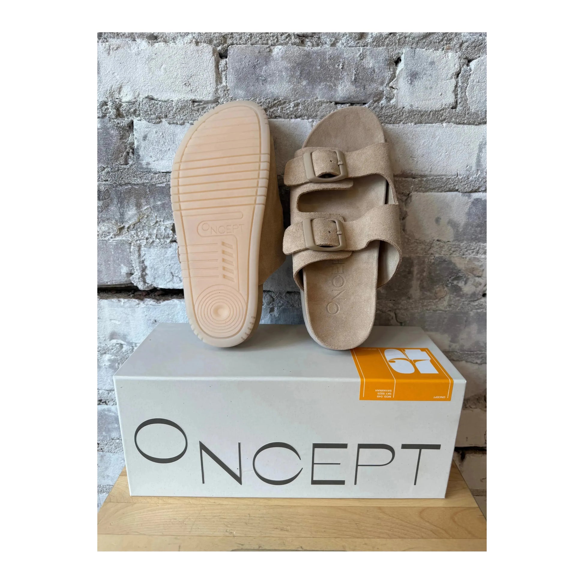 Women's Savannah Hydro-Suede Slide sandals in Sand Castle by Oncept, featuring a comfortable slip-on design and textured suede material.