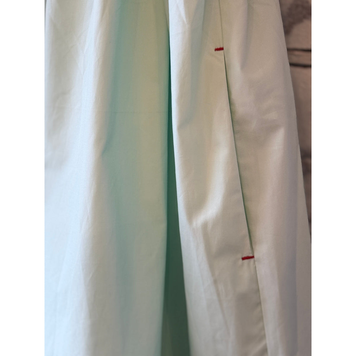 Women's mint scallop dress by Brazeau Tricot, featuring a fitted bodice and scalloped hem, styled on a model.