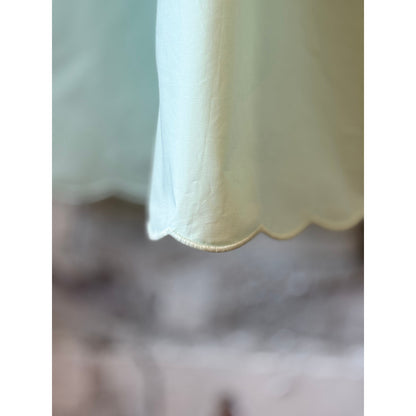 Mint women's scallop dress by Brazeau Tricot featuring a fitted silhouette and delicate scallop detailing.