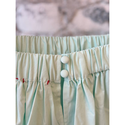 Women's mint scallop dress by Brazeau Tricot, featuring a stylish scalloped hem and elegant fit, shown on a model.