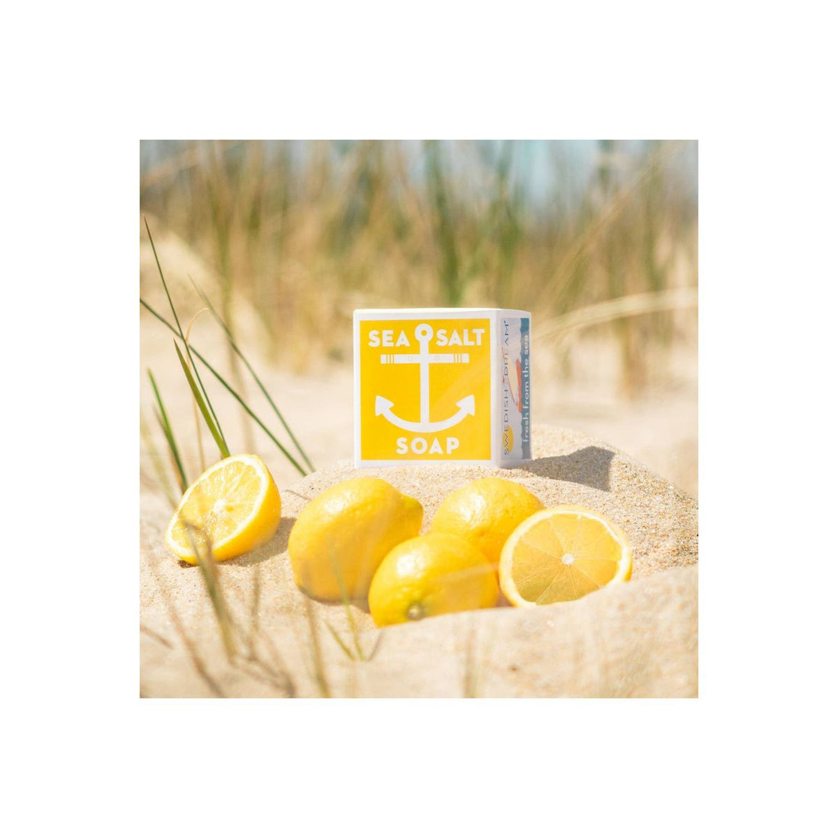 Kalastyle Soap Co. sea salt lemon soap bar with natural textures and fresh lemon slices for a refreshing skincare accessory.