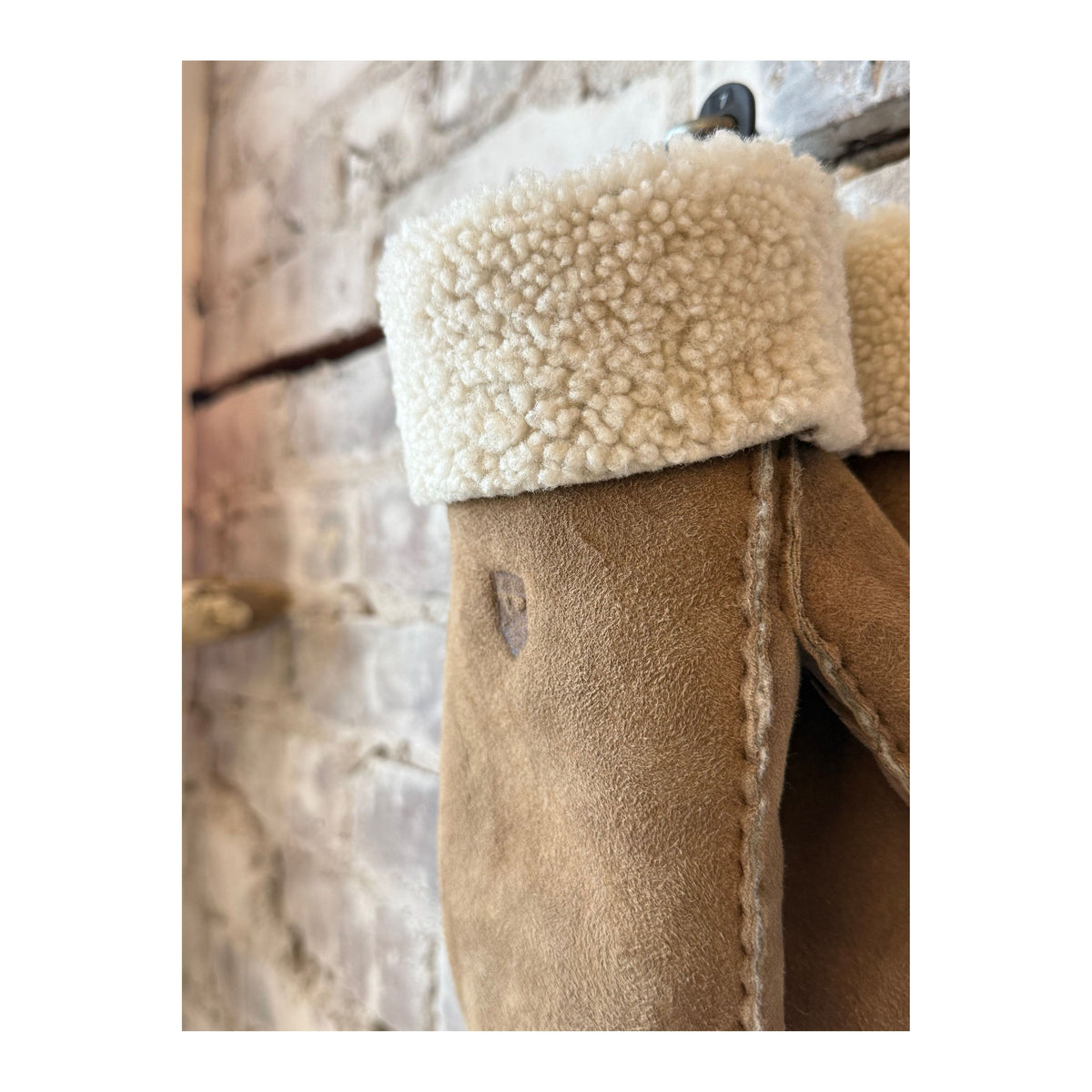 Beige Hestra women’s sheepskin mitt showing soft, insulated interior and stylish exterior, designed for warmth and comfort.