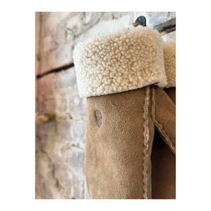 Beige Hestra women’s sheepskin mitt showing soft, insulated interior and stylish exterior, designed for warmth and comfort.