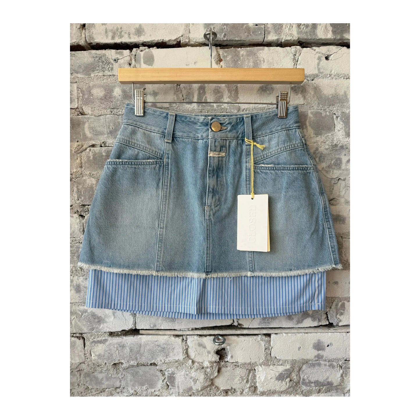 Light blue women's denim poplin mini skirt by Closed Women's, showing the fitted high-waist style and classic denim texture.